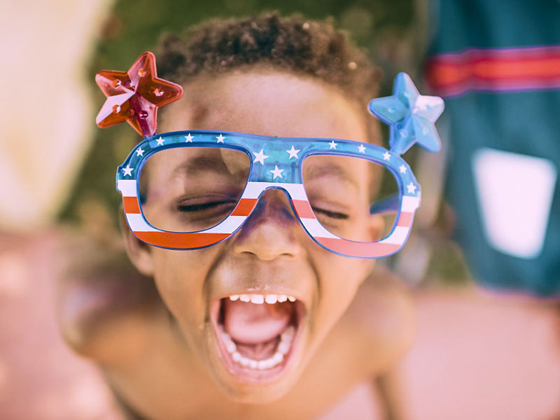 Campaign Principle Child Wearing USA Flag Branded Glasses